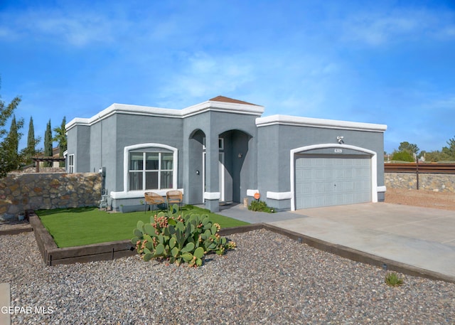 view of front of home with a front lawn and a garage