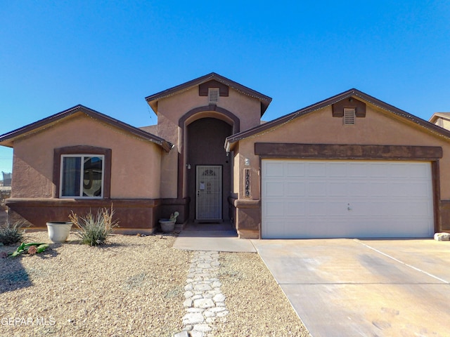 view of front of home with a garage