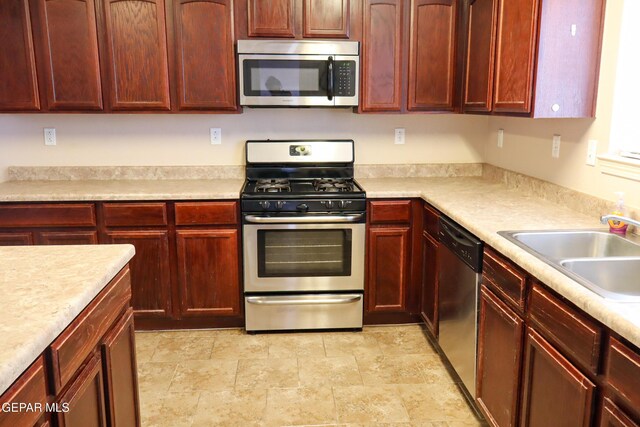 kitchen featuring stainless steel appliances and sink