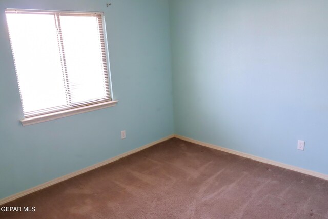 view of carpeted spare room