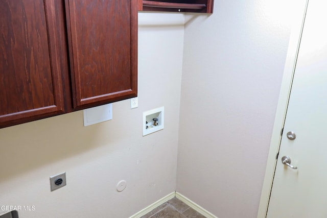 laundry room featuring hookup for an electric dryer, hookup for a gas dryer, tile patterned flooring, washer hookup, and cabinets