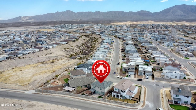 birds eye view of property with a mountain view