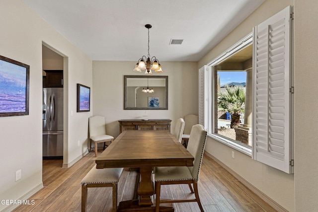 dining space featuring a chandelier