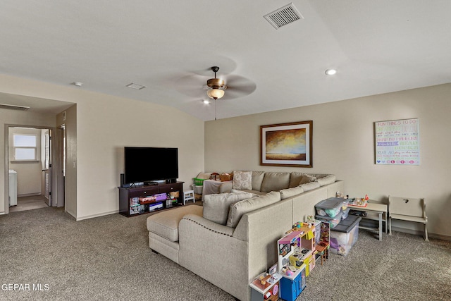 carpeted living room featuring ceiling fan and lofted ceiling