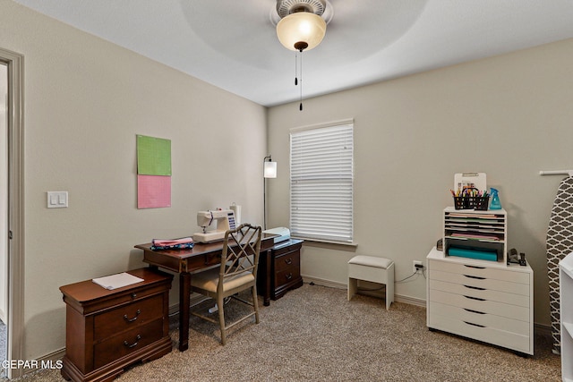 office area featuring light colored carpet and ceiling fan