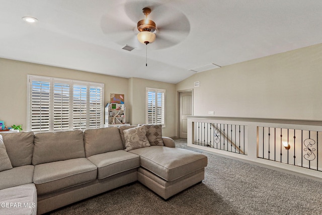 living room with ceiling fan, carpet flooring, and lofted ceiling