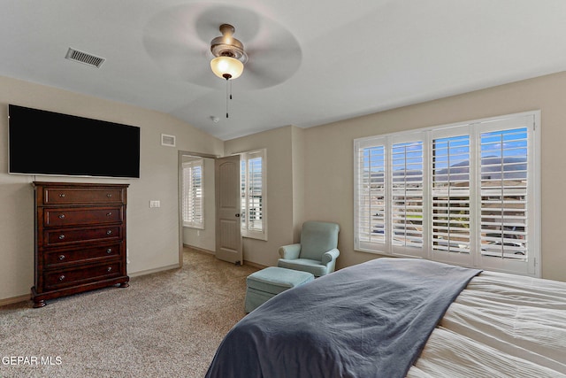 carpeted bedroom with ceiling fan and lofted ceiling