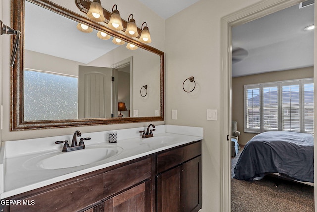 bathroom with a healthy amount of sunlight and vanity