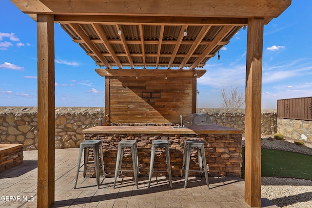 view of patio / terrace featuring exterior bar