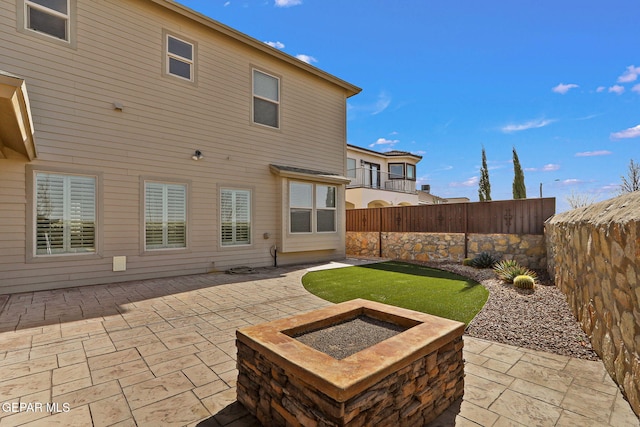 rear view of property featuring a patio area