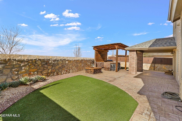 view of yard with a patio, a gazebo, and exterior kitchen