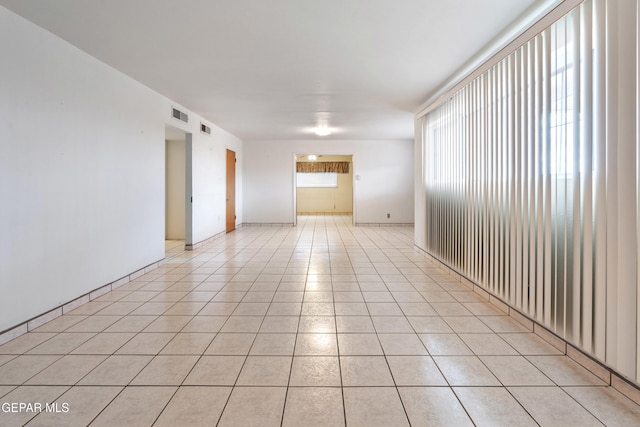 empty room featuring light tile patterned floors