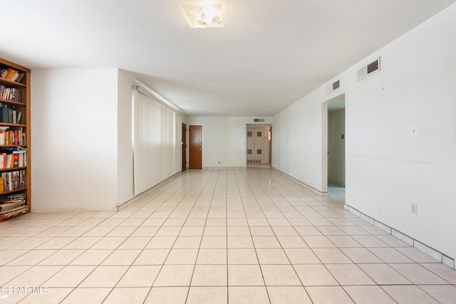 empty room with light tile patterned flooring