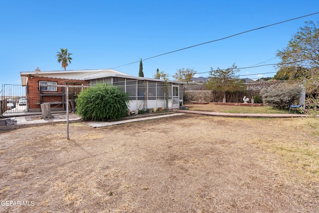 3405 Volcanic Ave, El Paso, TX 79904 - rear view of house with a sunroom