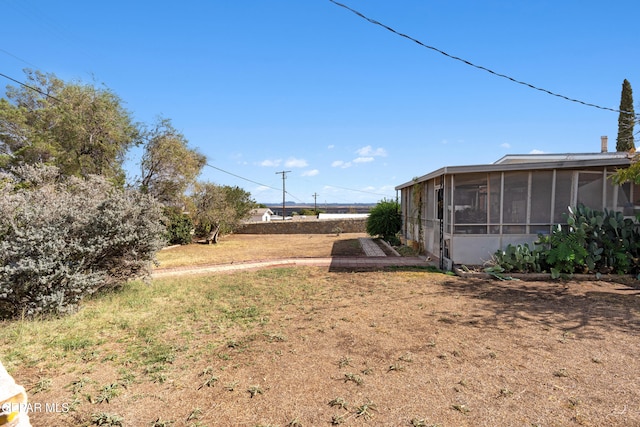 view of yard with a sunroom