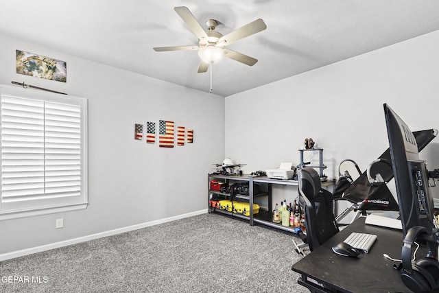 exercise room with carpet flooring and ceiling fan