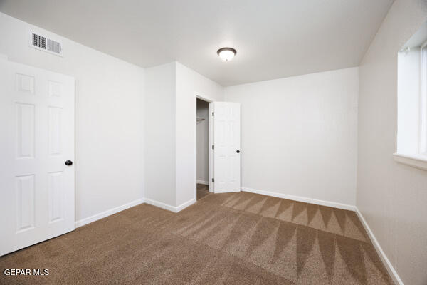 unfurnished bedroom featuring carpet flooring