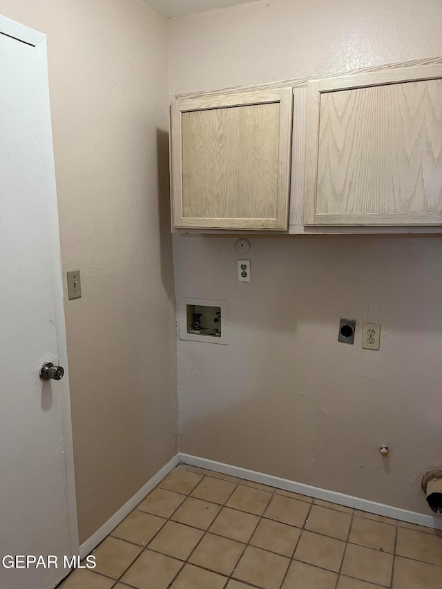 laundry room featuring light tile patterned flooring, washer hookup, cabinets, and hookup for a gas dryer