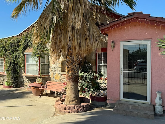 doorway to property with a patio