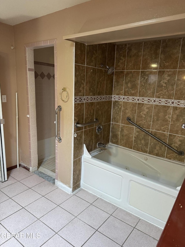 bathroom with tile patterned flooring and tiled shower / bath combo