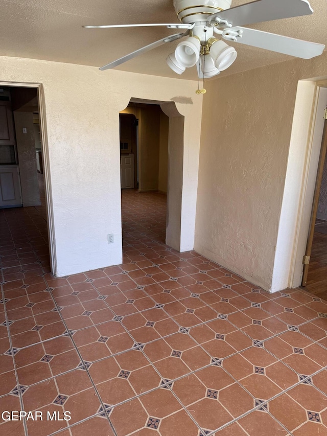 spare room featuring ceiling fan