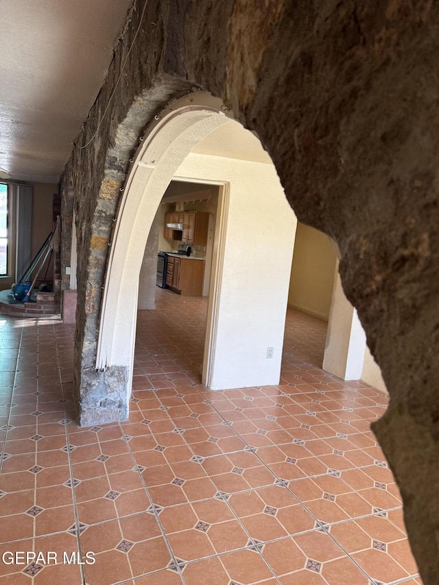 hallway featuring tile patterned flooring