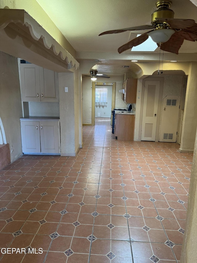 kitchen with light tile patterned floors and range