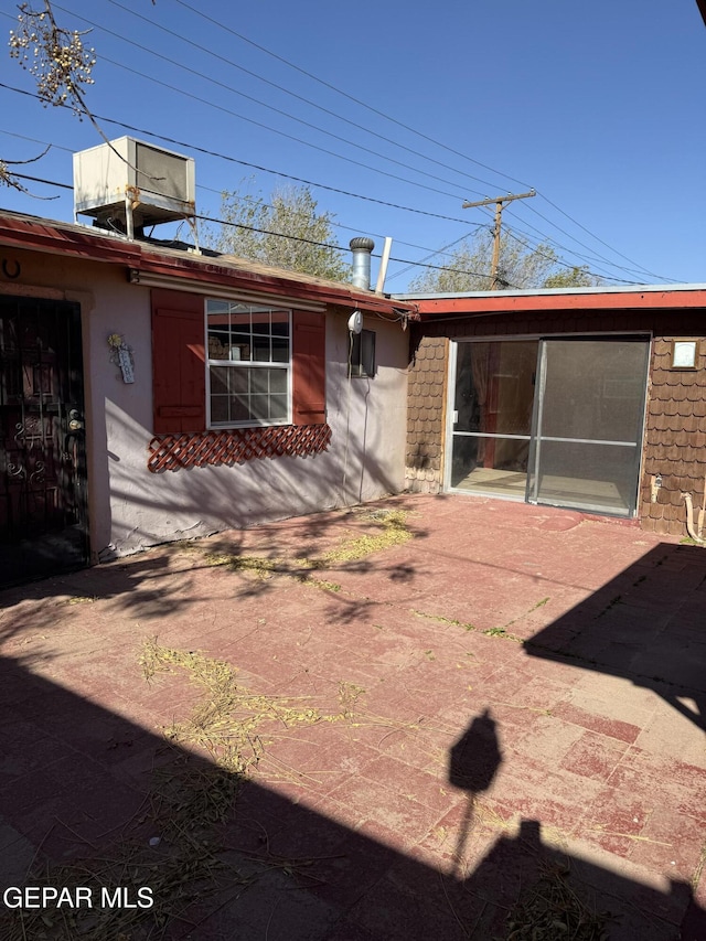 rear view of property featuring a patio