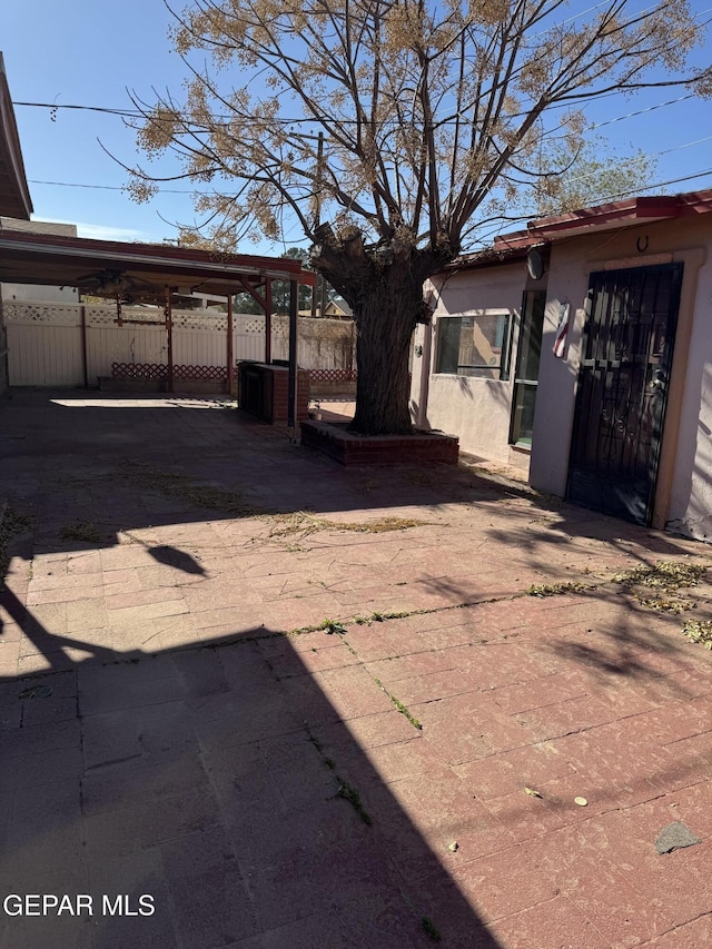 exterior space with a carport