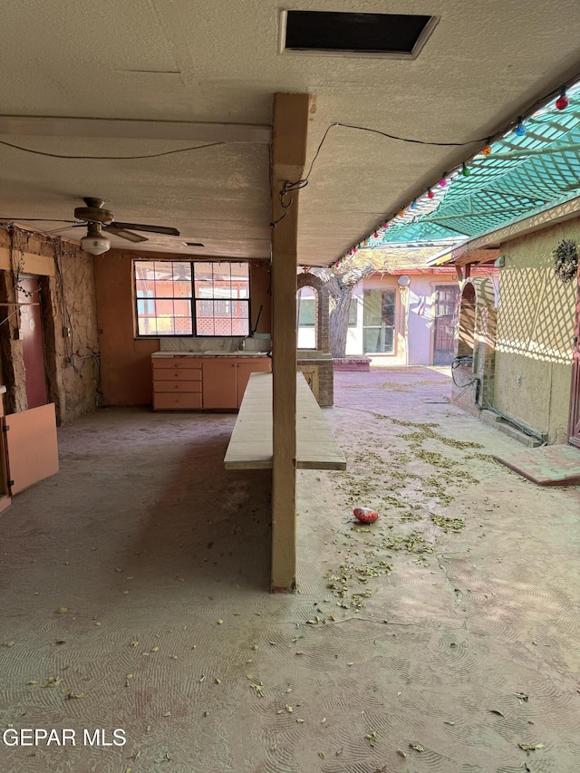 view of patio featuring ceiling fan