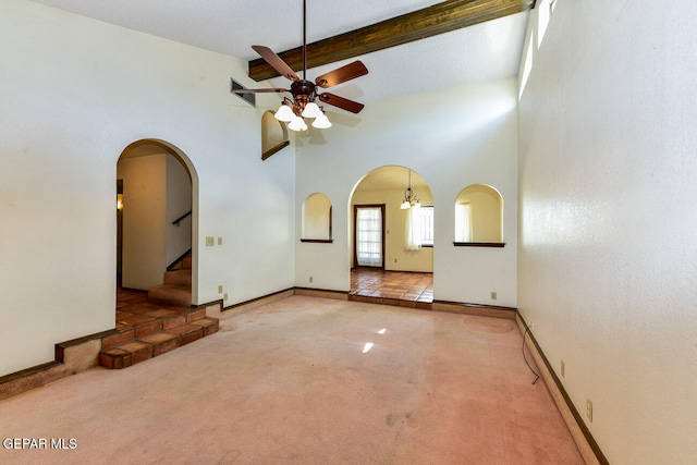 unfurnished room with ceiling fan with notable chandelier, carpet floors, a textured ceiling, high vaulted ceiling, and beam ceiling