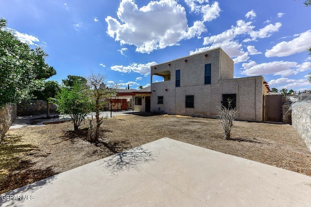 back of house with a patio