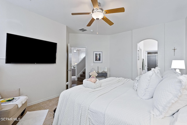 bedroom with light tile patterned flooring and ceiling fan