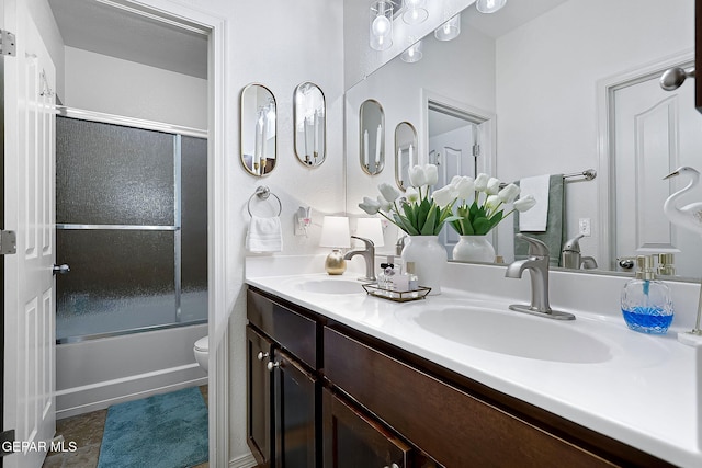 full bathroom with shower / bath combination with glass door, vanity, and toilet