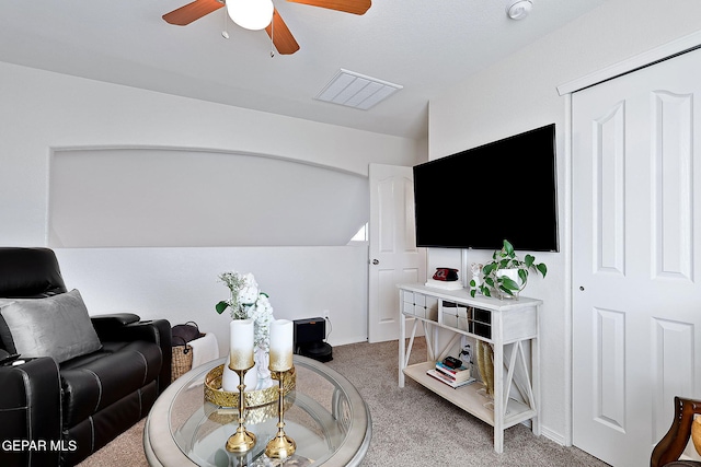 living room with lofted ceiling, carpet, and ceiling fan