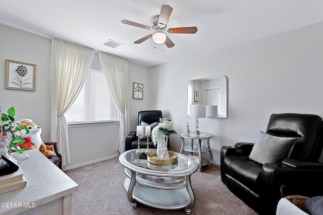 sitting room with light colored carpet and ceiling fan