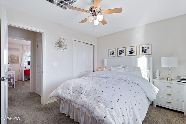 bedroom with ceiling fan, a closet, and carpet floors