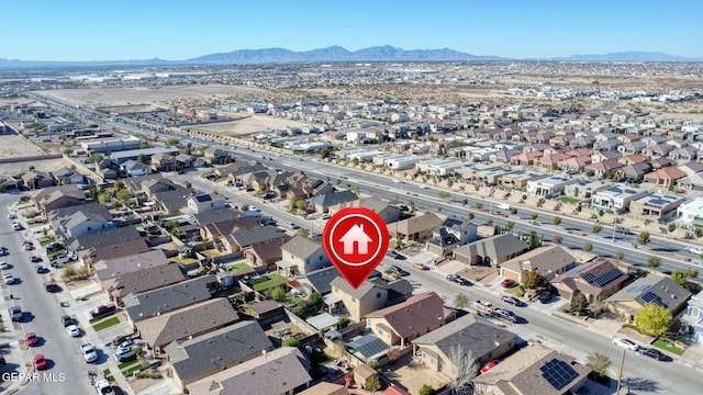 birds eye view of property featuring a mountain view