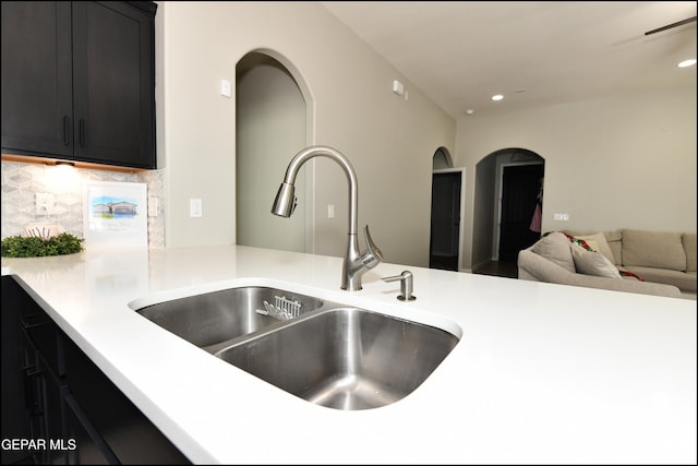 kitchen featuring decorative backsplash and sink