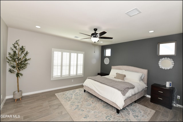 bedroom featuring hardwood / wood-style floors and ceiling fan