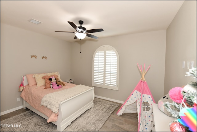 bedroom with ceiling fan and hardwood / wood-style floors