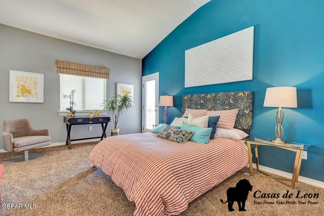 carpeted bedroom with lofted ceiling