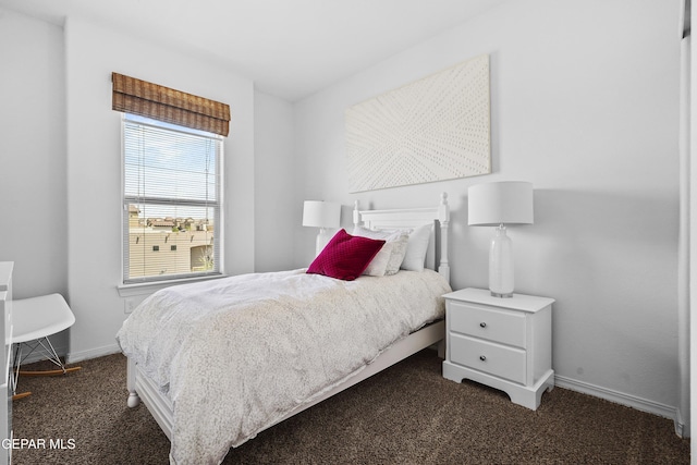 bedroom featuring carpet flooring and baseboards