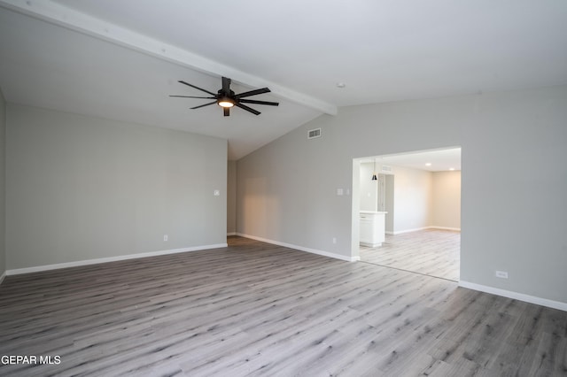 empty room with ceiling fan, vaulted ceiling with beams, and light hardwood / wood-style flooring