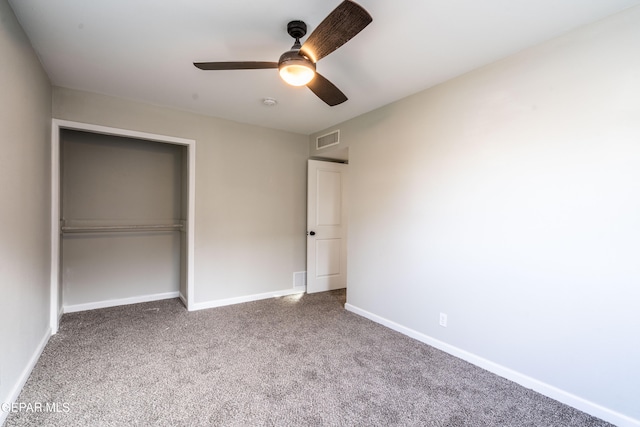 unfurnished bedroom with carpet flooring, ceiling fan, and a closet