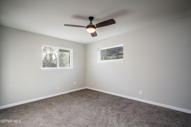 carpeted empty room featuring ceiling fan