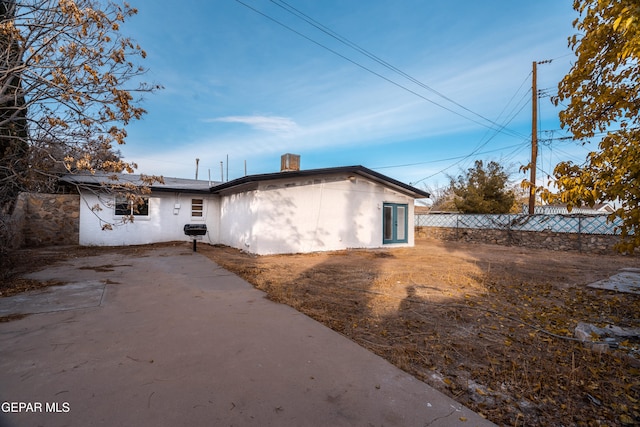 back of property with a patio area