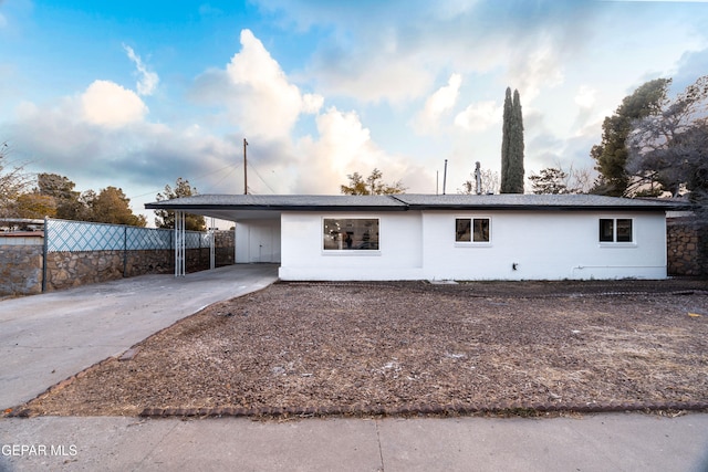 view of front of house with a carport