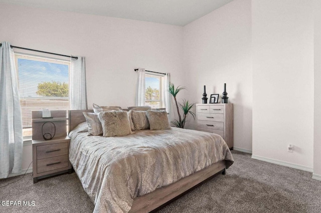 bedroom featuring carpet flooring and vaulted ceiling