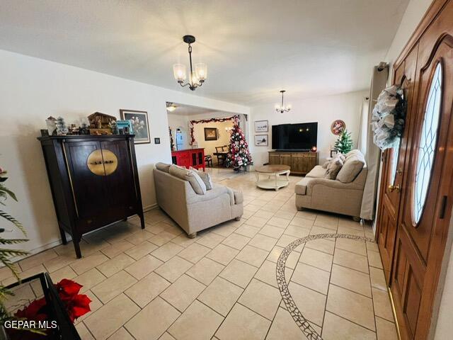 living room featuring a notable chandelier